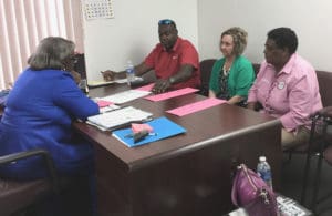 From left, V.I. Supervisor of Elections Caroline Fawkes, Business Development Manager of ES&S Willie Wesley Jr., BVI Supervisor of Elections Juliette Penn; and Sheri Menges of ES&S, meet on Tortola. (V.I. Elections Office photo)