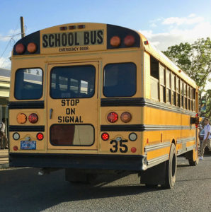 A school bus picks up students at a St. Croix school in 2017. (Ivy Hunter photo)