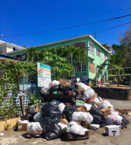 This photo of the trash bin near the Julius E. Sprauve School was taken June 15. The site was cleared two days later but was overflowing again within the week.