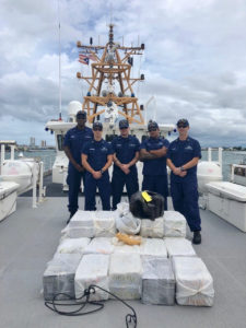 Coast Guard Cutter Donald Horsley crew members with a seized cocaine shipment, valued at $30 million, in Puerto Rico, following the interdiction of a drug smuggling go-fast boat Saturday off Luquillo, Puerto Rico. (U.S. Coast Guard photo)