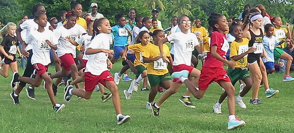 Elementary school age girls take off on the one-mile course at UVI. (V.I. Pace Runners photo)