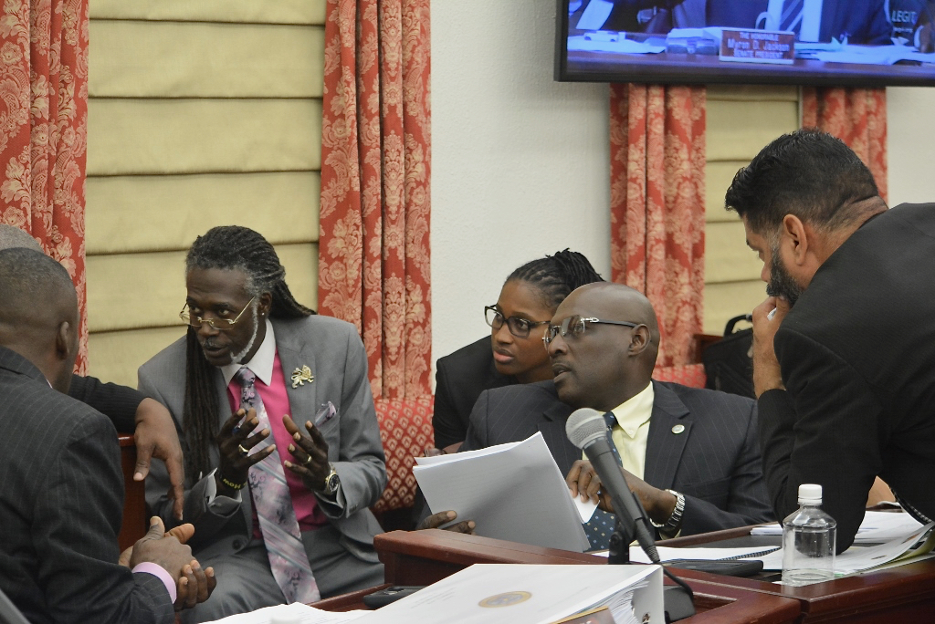 Members of the V.I. Legislature consult during Friday's session on St. Thomas. (Photo by Barry Leerman for the V.I. Legislature)