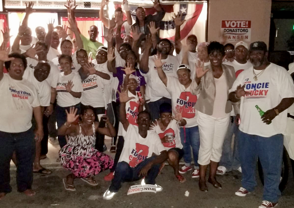 Sen. Alicia 'Chucky' Hansen and supporters of the Adlah 'Foncie' Donastorg/Hansen ticket join with members of the Albert Bryan/Sen. Tregenza Roach campaign Thursday evening. (Photo submitted by the Bryan/Roach campaign)