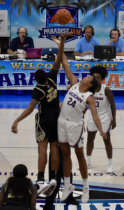 UConn’s Napheesa Collier, 24 in the white, and Purdue’s Ae’Rinna Harris, 32 in black, battle for the opening tip at the UVI’s sports and Fitness in the Final Day of 2018 Paradise Jam.