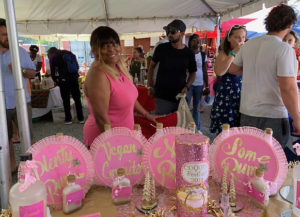 Edna Santiago of Mamacita's Coquito, pretty in pink, serves vegan-style at 2018 Coquito Festival. (Anne Salafia PHOTO)