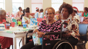 Senior resident Ruthina Hodge, 85, and her daughter Normalie Joseph attend Tuesday’s Christmas party.