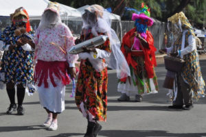 A traditional masquerade troupe takes part in a Crucian Christmas Festival parade. (File photo)