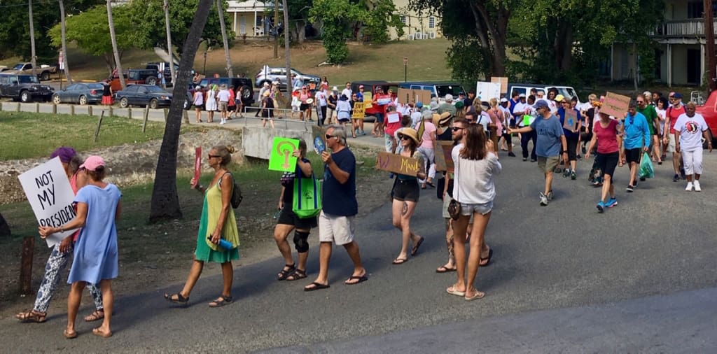 More than 100 strong, the St. John Women's March carries its message through Cruz Bay.