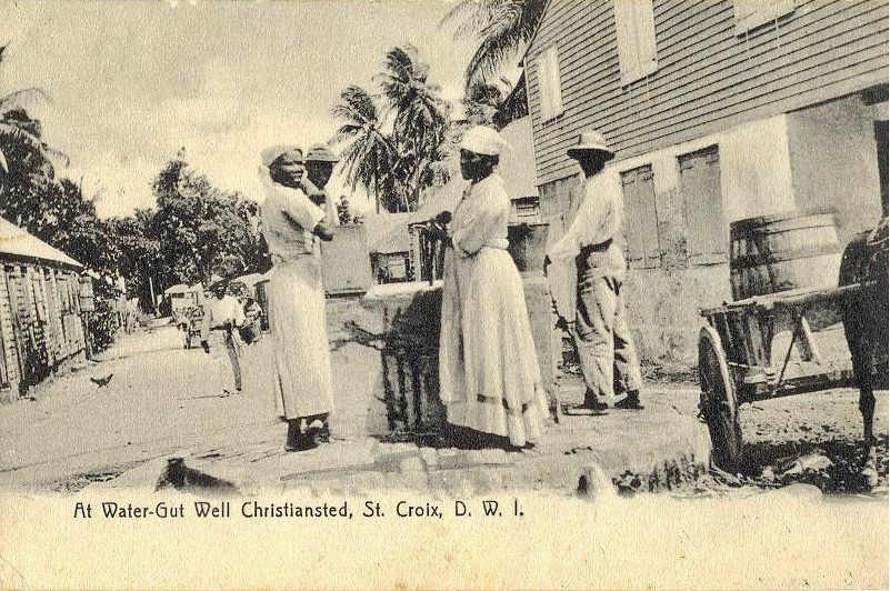 People gather water at the well in Watergut a century or more ago.