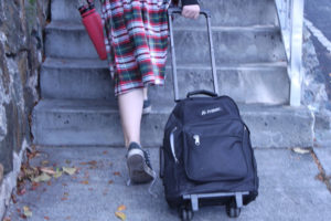 A girl heads home in her Joseph Sibilly Elementary School uniform skirt.