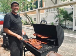 Joe Smith of Smoke STX cooks ribs on an offset smoker. (Elisa McKay photo)