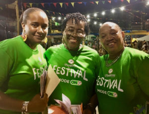 Membesville volunteers Aliah Lockhart, Alecia Wells, and Enid Doway enjoy opening night. (Source photo by Amy Roberts)