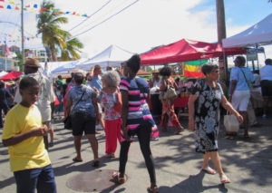 Visitors peruse the goods at the 2019 St. John Festival Food Fair. (Source photo by Raven Phillips)