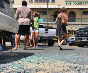 People examine the damage of the Marketplace mayhem. (Judi Shimel photo)
