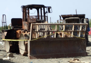 A bulldozer that was set on five June 17 at Anguilla Landfill. (Source photo by Susan Ellis)