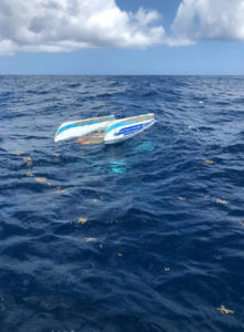 Coast Guard crews and the Good Samaritan vessel One Life combined efforts to rescue 36-year-old Kevin Wenk of the U.S. Virgin Islands from the water Tuesday, after his 12-foot catamaran capsized north of Culebra Island. (Photo by U.S. Coast Guard)