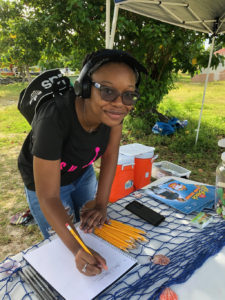 Jada Roberts, a junior at UVI, is the first of 185 volunteers to show up for the premier 2019 Coast Weeks clean-up on St. Thomas. (Source photo by Teddi Davis)