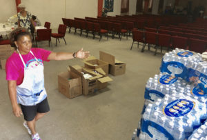 Paradise Covenant Ministries relief drive volunteer Jacqueline Clendinen shows off some of the donated items received Saturday for victims of Hurricane Dorian in the Bahamas. (Source photo by Judi Shimel)