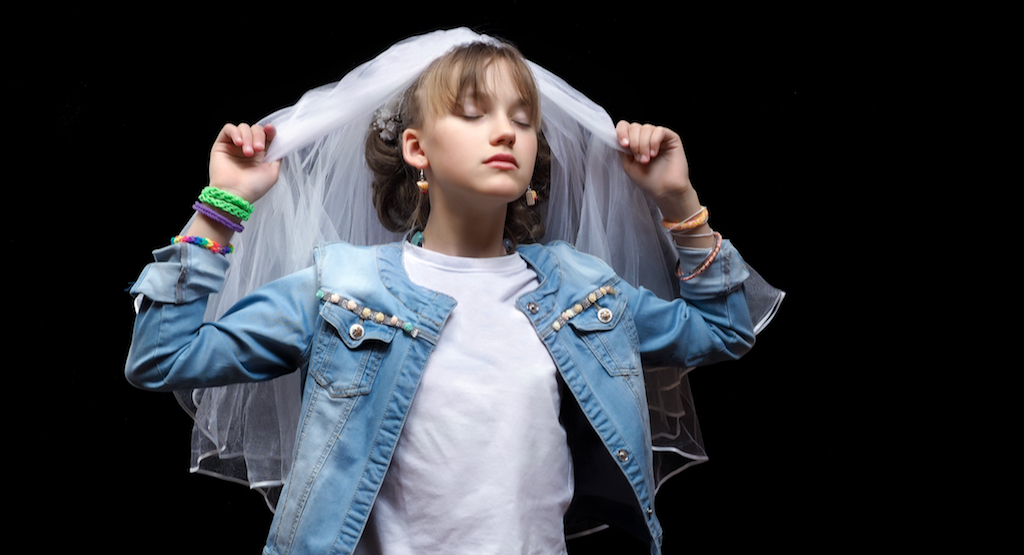 According to the World Bank, 41,000 girls younger than 18 get married every day. (Child wedding image from Shutterstock)