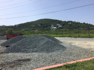 one of the piles of gravel ready to be spread across the parking lot. (Source photo by Amy Roberts)