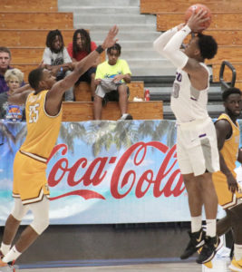 Charles Johnson, who had 27 points in Grand Canyon’s opening day loss, shoots over Valparaiso’s Nick Robinson Jr. (Photo by Basketball Travelers)