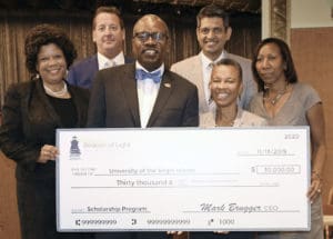 Gov. Bryan and UVI officials accept Hospitality Scholarship funds from Frenchman’s Reef Marriott Beach Resort and DiamondRock Hospitality. Form left, UVI Dean of Business Kendra Harris; Kurt Wiksten, managing director of Frenchman's Reef Marriott Beach Resort and Noni Beach; Gov. Albert Bryan Jr.; Shalinder Singh, vice president of asset management, DiamondRock Hospitality; Camille McKayle, provost and VP of academic affairs at UVI; and Tamara Lang, UVI's director of hotel and tourism management.