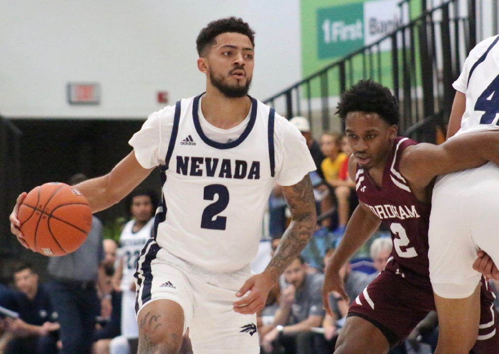 Jalen Harris, who was the player of the game in Nevada’s opening day victory, dribbles past a Fordham defender who struggles to get through a pick. (Photo by Basketball Travelers)