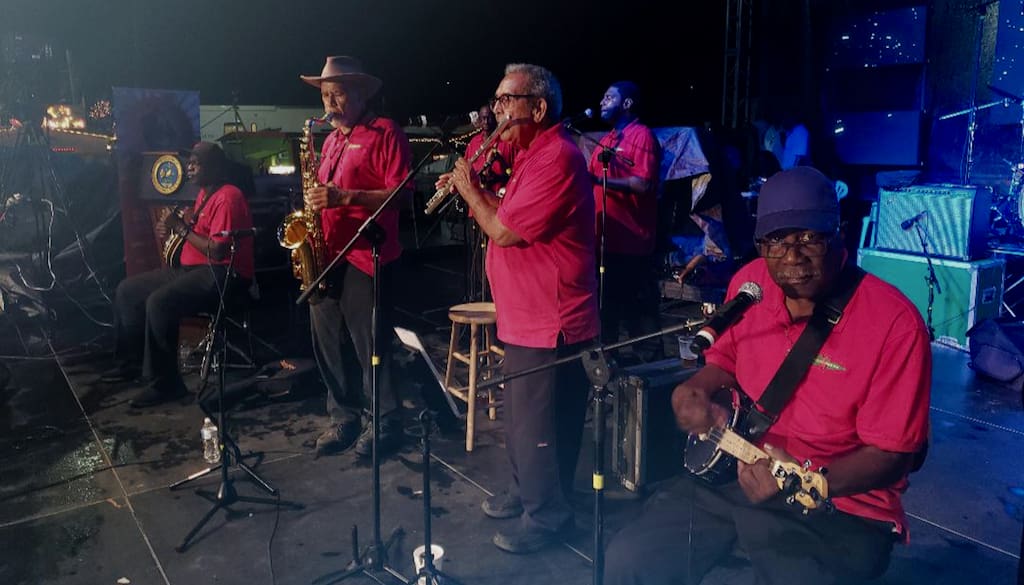 Stanley and the 10 Sleepless Knights perform Thursday at the opening of the Festival Village. (Source photo by Melody Rames)
