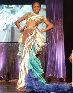 Second runner-up Tatyana Massiah models the high-fashion gown that won her that segment of the competition. (Source photo by Melody Rames)