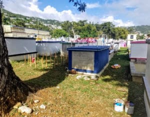 Rusty paint cans and debris are left on the grounds of St. Thomas’ Western Cemetery. (Source photo by Bethaney Lee)