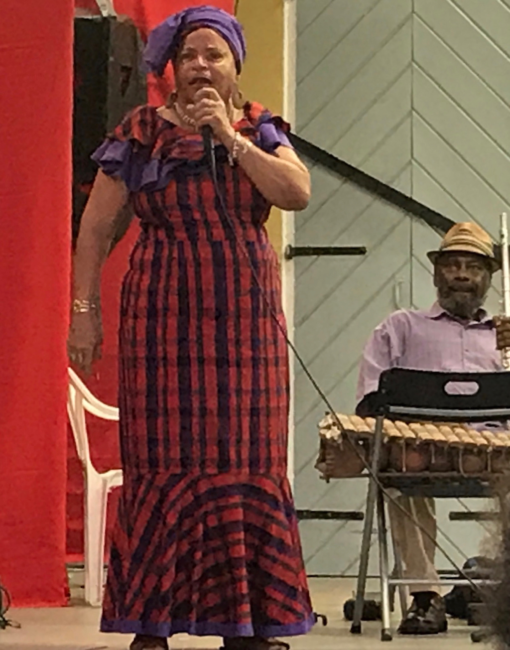 Cedelle Petersen Christopher, who learned Cariso from Leona Watson, performs 'Clear de Road' and 'Sly Mongoose.' Christopher is a retired educator who performs Cariso and storytelling and makes puppetry for school children. (Source photo by Elisa McKay)