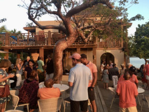 Guests mingle at Lovango Cay during a pre-opening tour in February. (Source photo by Amy H. Roberts)