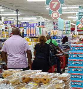 Customers wait in line at Pueblo Long Bay. (Source photo by S. Pennington)