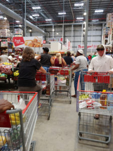 While the government prepares to close farmers markets to prevent the spread of the coronavirus, shoppers find themselves in long, tightly packed lines at Cost U Less on St. Thomas. Source photo by S. Pennington)