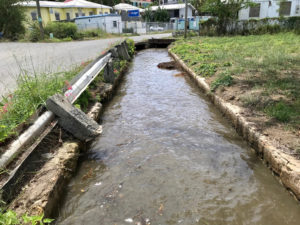 Even during sunny days, guts such as this one in Christiansted near the seaplane terminal can be flooded with ocean water. (Photo by Kelsey Nowakowski)