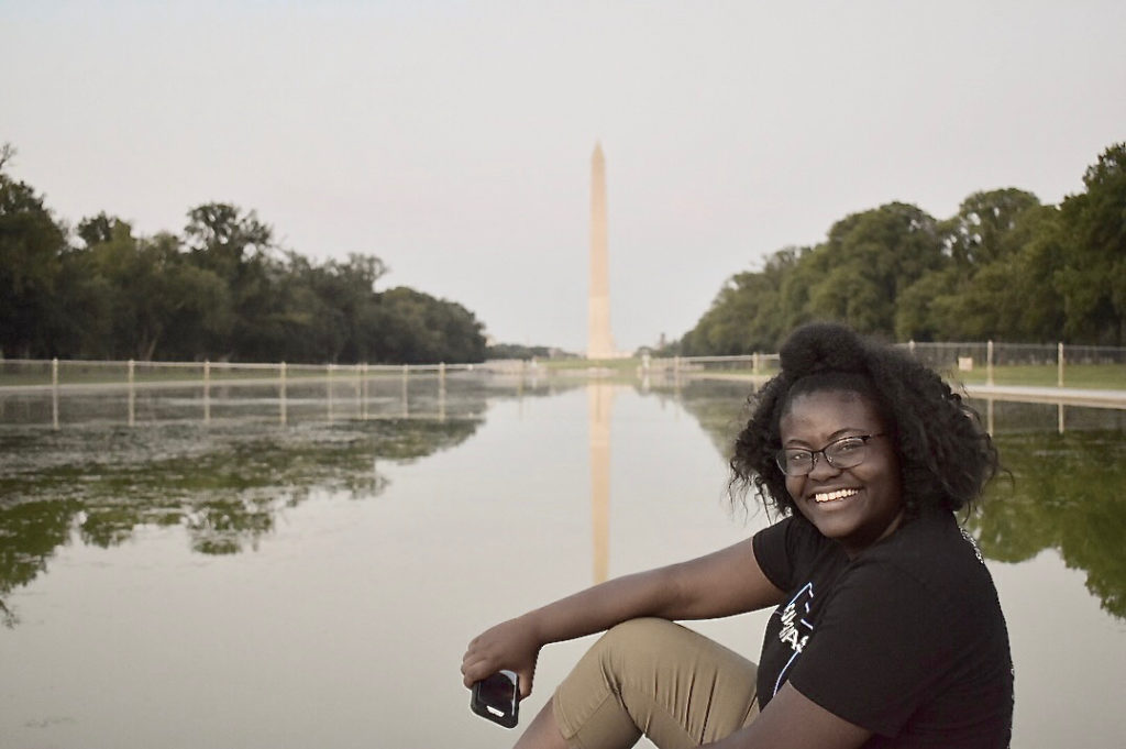 During her summer internship in 2018 in Washinton D.C., Leah Trotman poses by the reflecting pool. (Photo by Adrianne Ralston)
