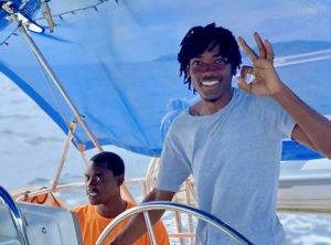 St. Thomas’ Shamar Lewis takes the wheel during the 2019 VIPCA Marine Apprenticeship. (Photo provided by VIPCA Marina Apprenticeship)