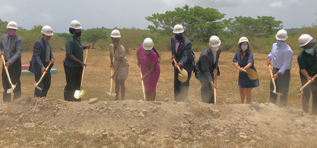 V.I. Government officials and representatives from Fresh Ministries and Farmers in Action turn the first shovels of dirt at the future site of an aquaponics center. (Source photo by Susan Ellis)