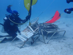 Divers attach lift bags to debris, which included lawn chairs and galvanized metal. (Photo submitted by Howard Forbes Jr.)