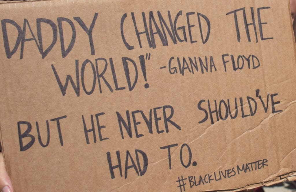 A sign references a viral video in which George Floyd's daughter says., “Daddy changed the world." (Source photo by Kyle Murphy)