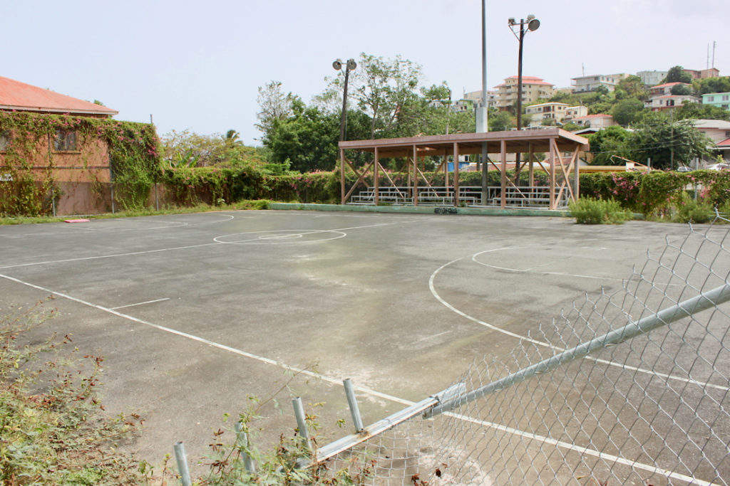 The basketball court in the Savan Playground and Park is devoid of lighting, backboards, and rims. (Source photo Bethaney Lee)
