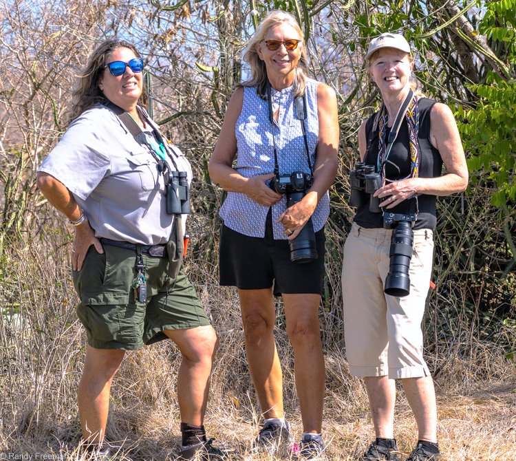 Park Ranger Laurel Brannick of the Virgin Islands National Park (l.) and Gail Karlsson, an environmental lawyer and a nature columnist for the Virgin Islands Source newspaper, share birding tips with writer Robbie Lisa Freeman. | Photo courtesy of Randy Freeman.