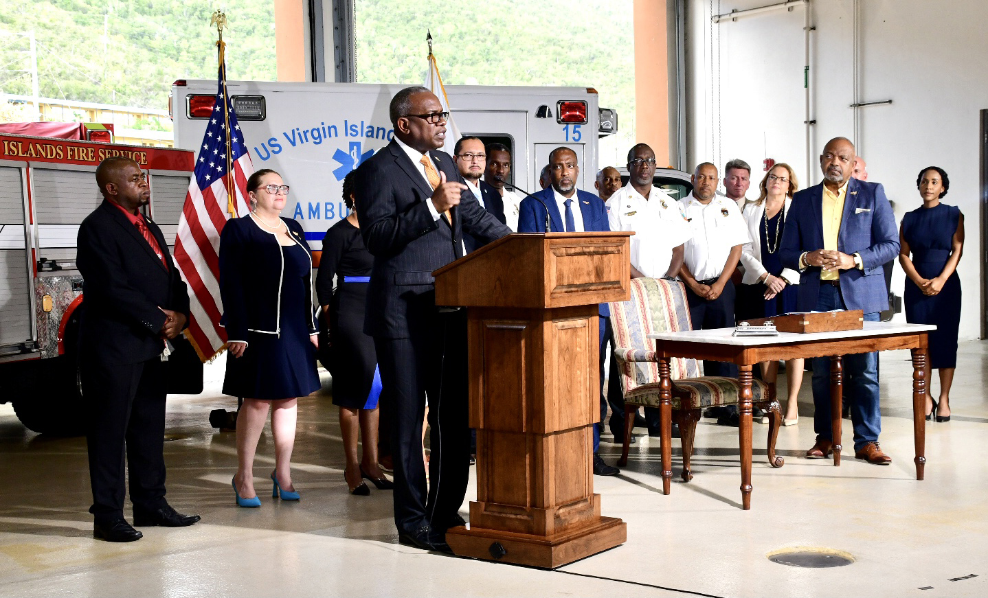 Gov. Albert Bryan Jr. addresses the audience at the signing of a bill merging the Fire Service and Emergency Medical Services on Friday at the Omar Brown Sr. Fire Station on St. Thomas. (Photo courtesy of Government House)