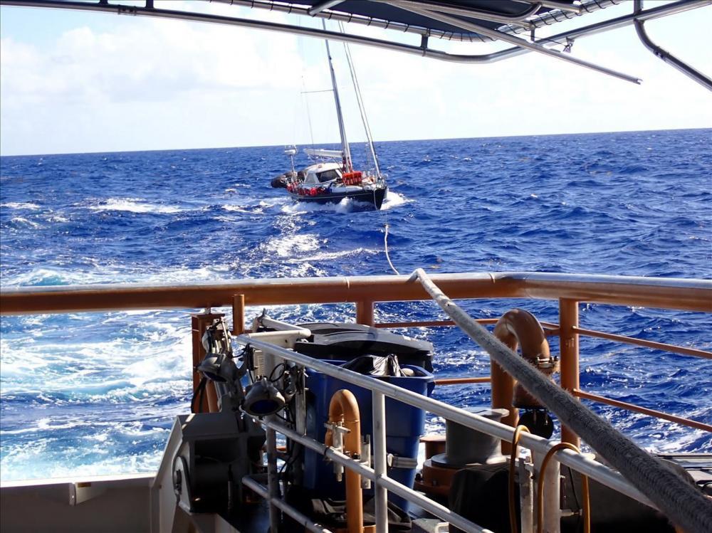 The Coast Guard Cutter Joseph Tezanos tows the sailing vessel Valour in the Atlantic Ocean June 24, 2022, approximately 300 nautical miles north of Puerto Rico. The four-day response involved Coast Guard air and surface crews, which rescued three mariners, U.S. citizens, and brought the sailing vessel to safe harbor in Fajardo, Puerto Rico the morning of June 26. (Photo by Ricardo Castrodad U.S. Coast Guard District 7 PADET San Juan)