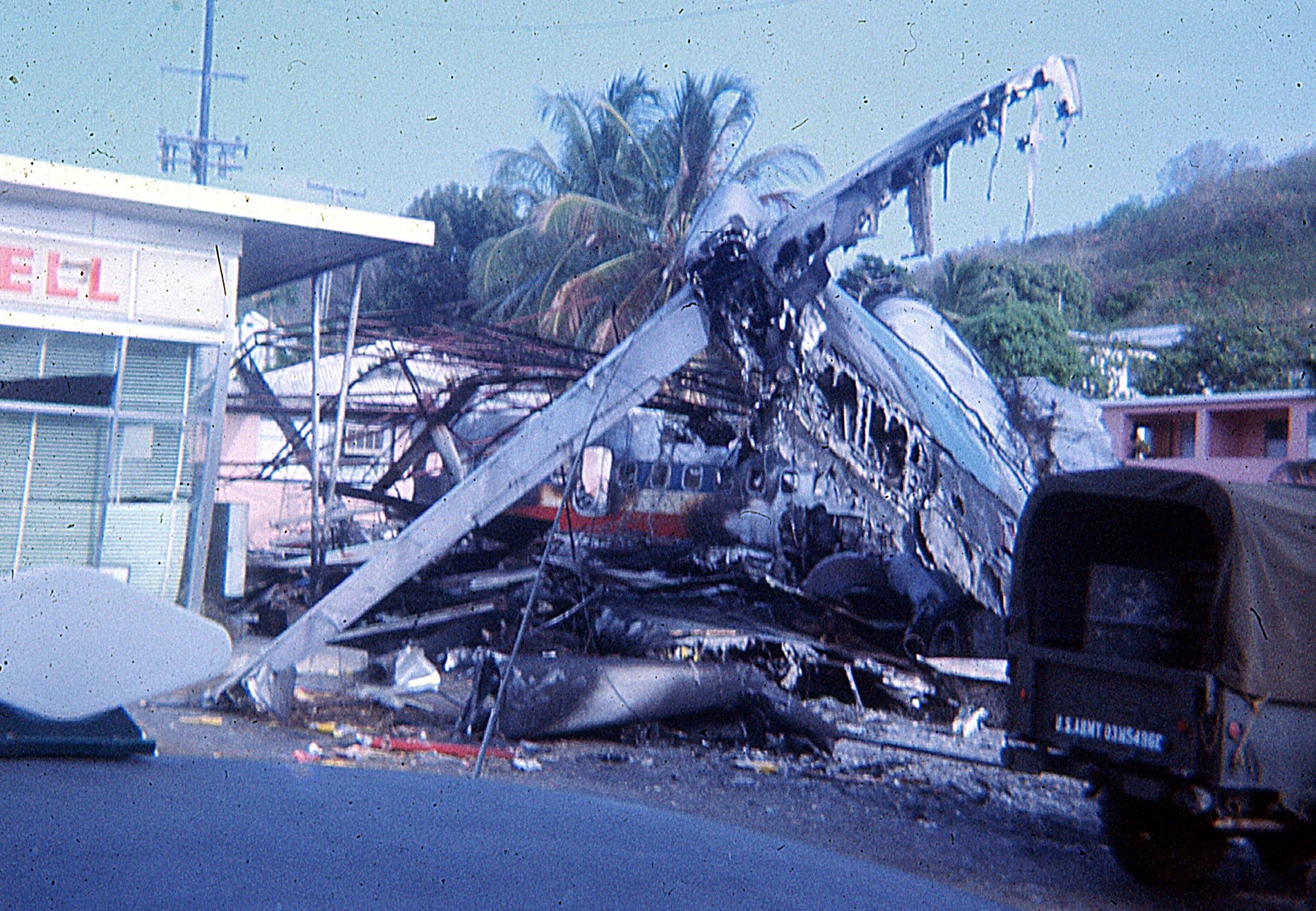 On April 27, 1976, an American Airlines Boeing 727 jetliner, while landing at the Harry S. Truman Airport (now the Cyril E. King Airport) on St. Thomas ran off the end of the runway and crashed into a Shell Gas Station, killing 37 (35 passengers and two flight attendants) of the 88 on board. (Wikipedia photo)
