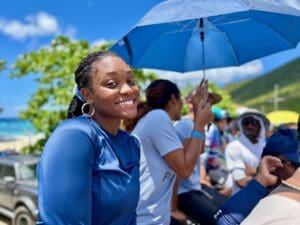 Aariyah Athanase from WAPA’s “We Got the Power” team is all smiles, as she roots for her team members. ( Source photo by Nyomi Gumbs)