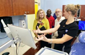 Dr. Stephanie Brown, FHC dentist, demonstrates how to use a new dental scanner donated by the Bennie and Martha Benjamin Foundation. L-R: Tina Beale, Stanley Jones, David Beale and Brown. (Submitted photo)