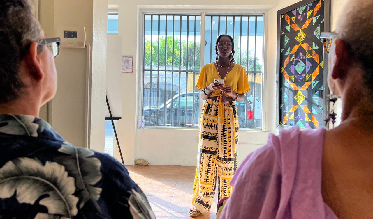 Yadayyah Leo, 15-year-old 9th grader from the St. Croix Educational Complex High School reading her poem “Ancestral Grounds” at the Cane Roots Art Gallery in Frederiksted. (Photo by DaraMonifah Cooper)