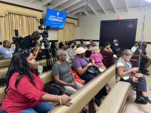 Audience members settle in before the townhall meeting at the Legislative Annex in Cruz Bay. (Source photo by Amy H. Roberts)