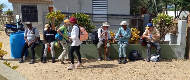 Members of the St. Croix Hiking Association wait at the Pals On the Beach hotel, ready for their first hike and waterfall in Belize. (Photo by Olasee Davis)